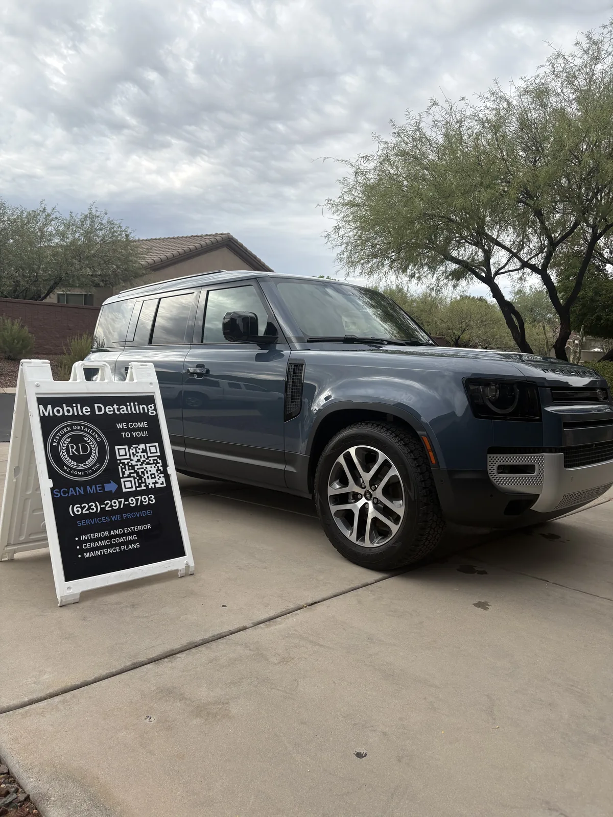 Land Rover Defender detailed on site, with the Restore Detailing sign out front