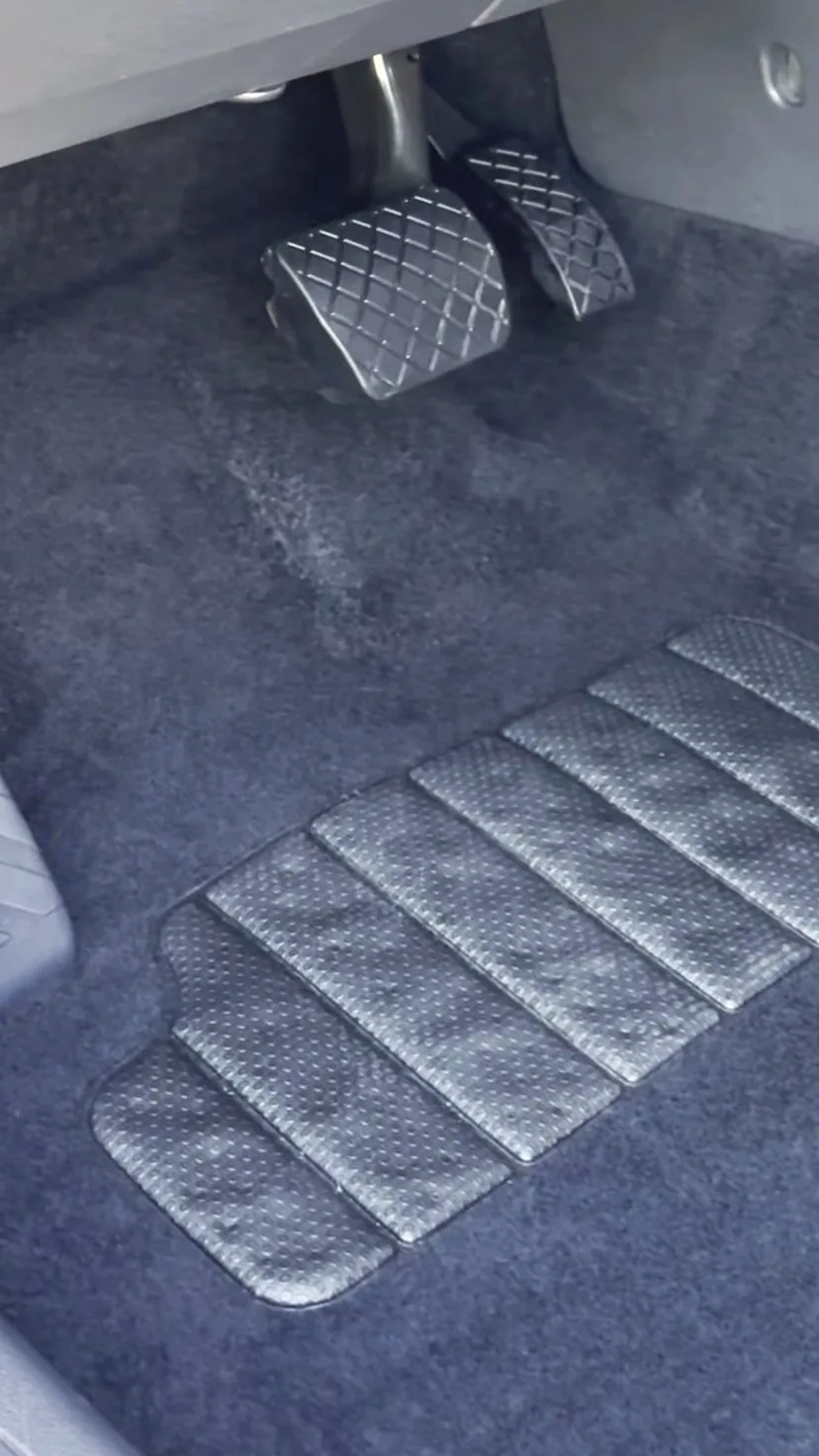 The same car footwell after a Restore Detailing interior clean, carpet restored