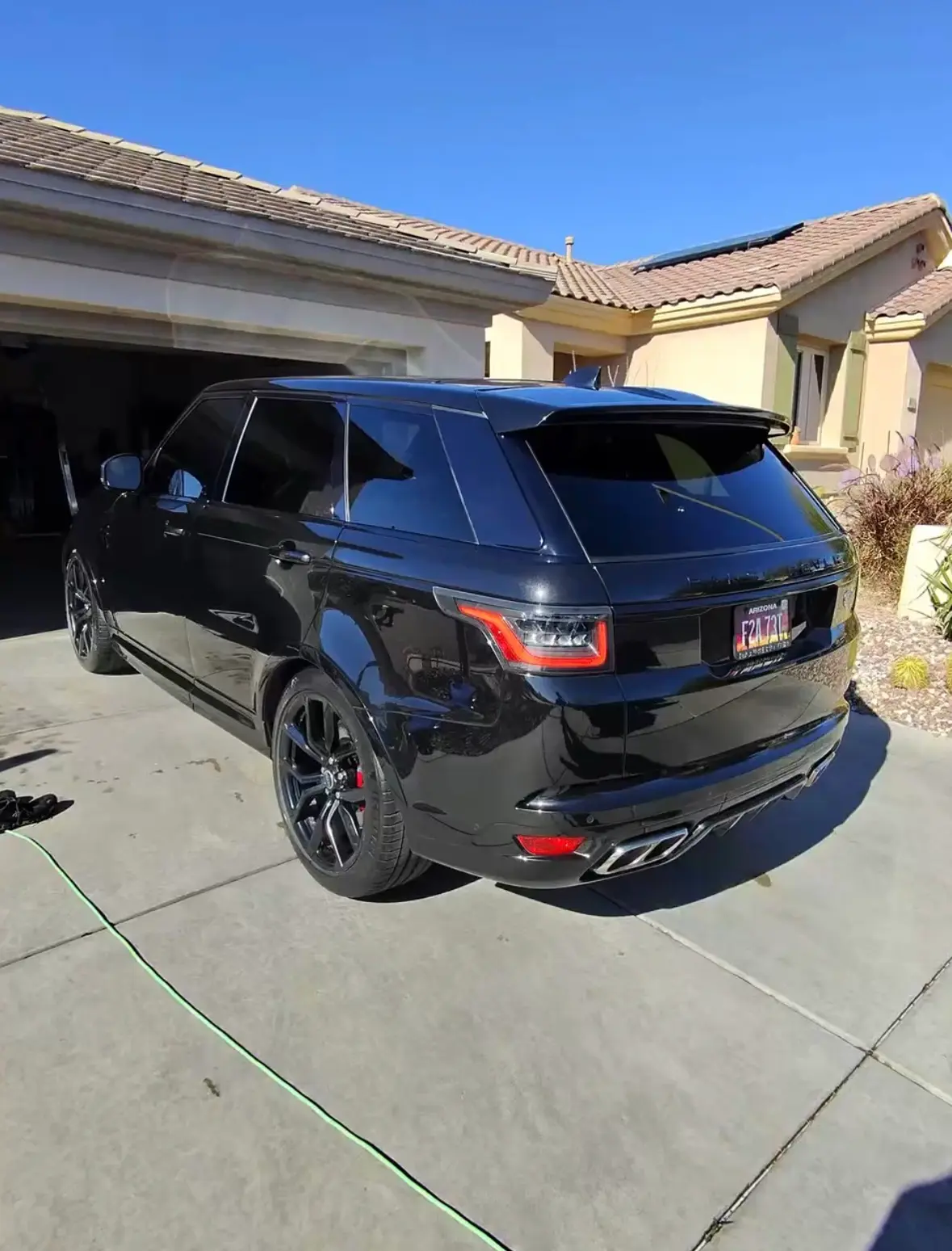 Deluxe detail on black Range Rover SUV in a Phoenix AZ driveway